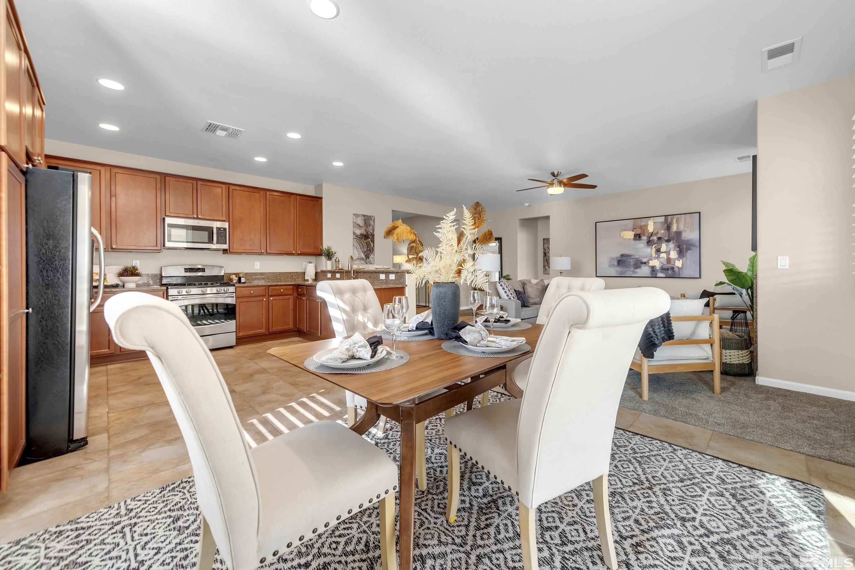 10797 Amber Falls Drive Reno, NV 89521 - Photo 25 of 38 a view of a dining room with furniture