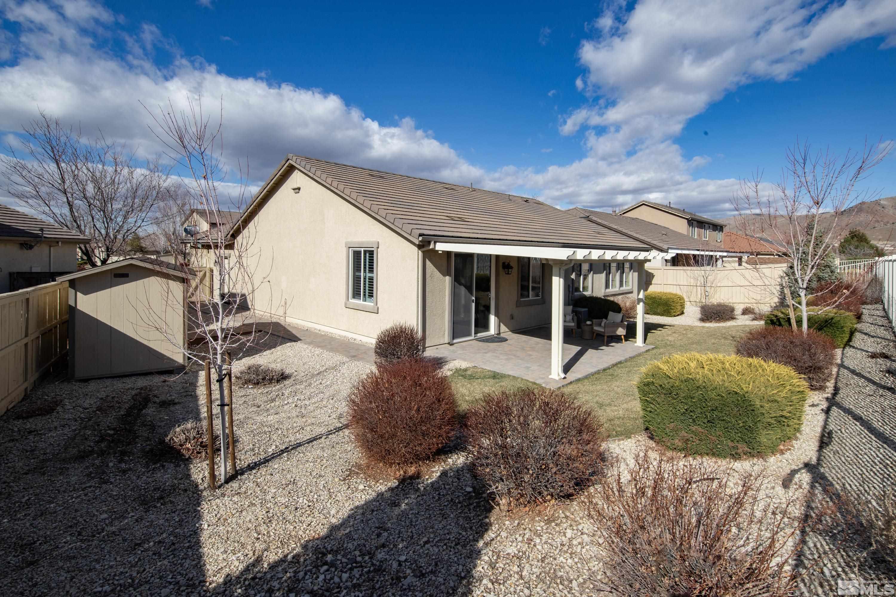 10797 Amber Falls Drive Reno, NV 89521 - Photo 29 of 38 a view of a house with backyard porch and sitting area