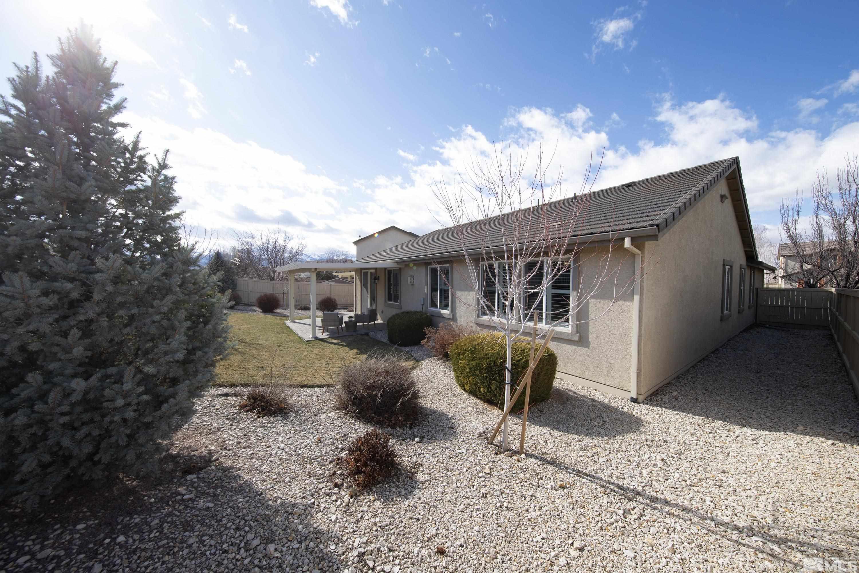 10797 Amber Falls Drive Reno, NV 89521 - Photo 32 of 38 a view of a house with backyard and sitting area