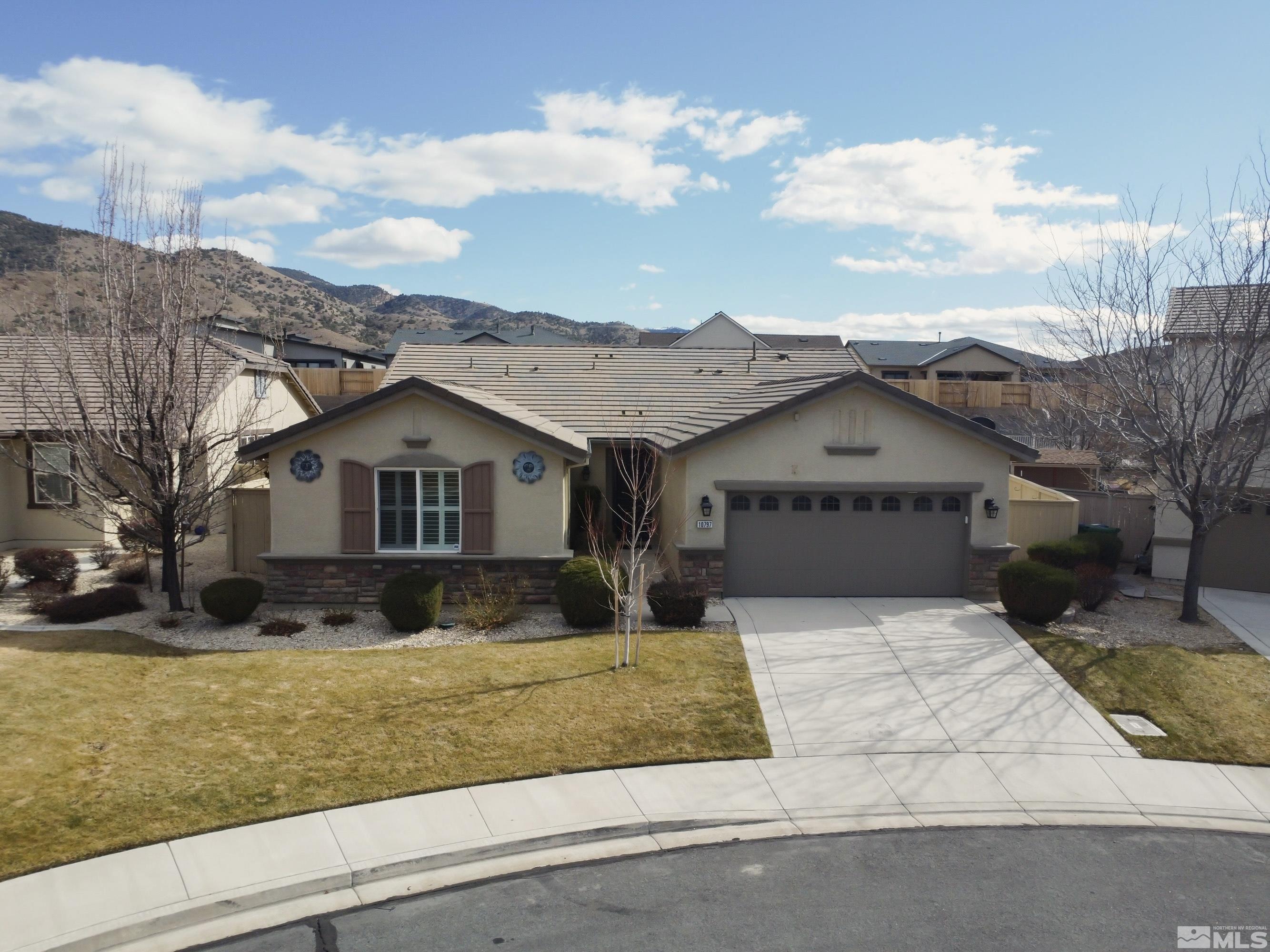 10797 Amber Falls Drive Reno, NV 89521 - Photo 35 of 38 a front view of a house with a yard