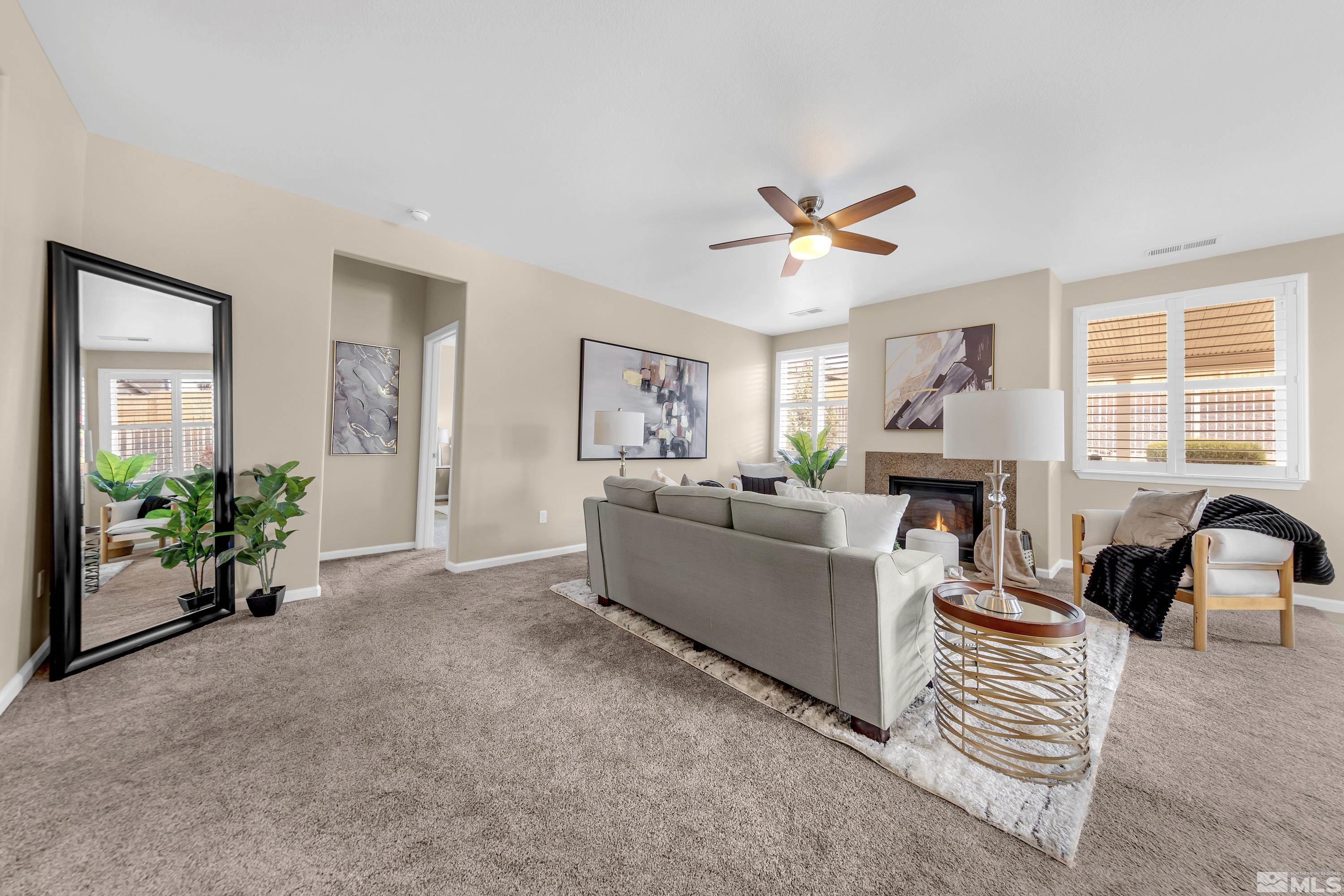 10797 Amber Falls Drive Reno, NV 89521 - Photo 8 of 38 a living room with furniture and a window