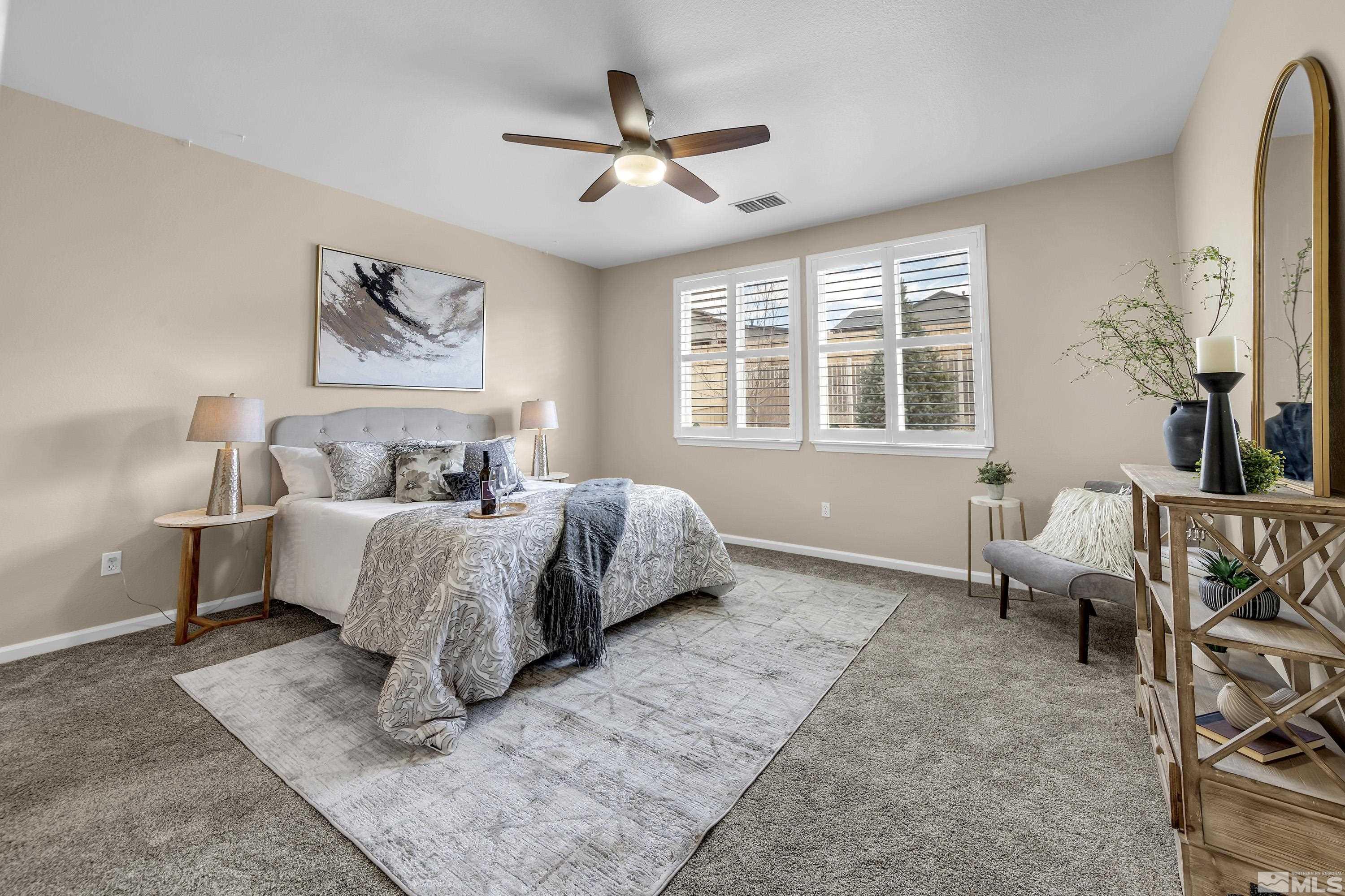 10797 Amber Falls Drive Reno, NV 89521 - Photo 10 of 38 a bedroom with a bed and wooden floor