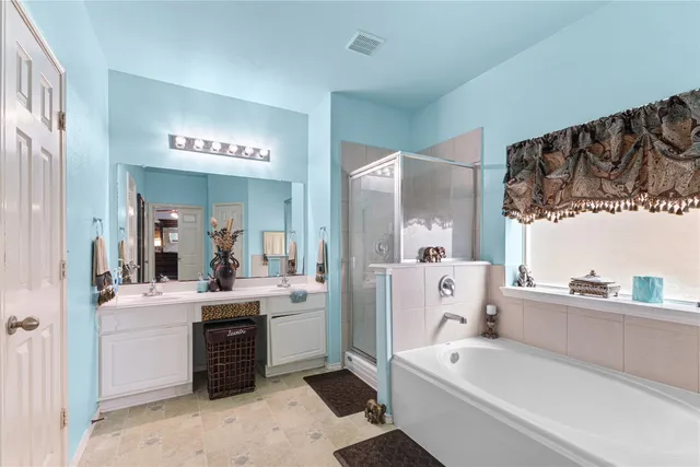 a large white kitchen with a large window