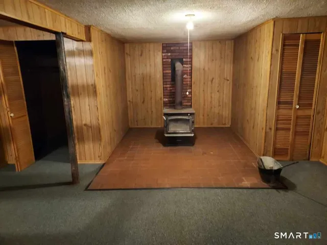 a view of a room with a wooden door