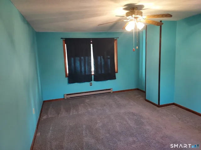 a view of a room that has a large window