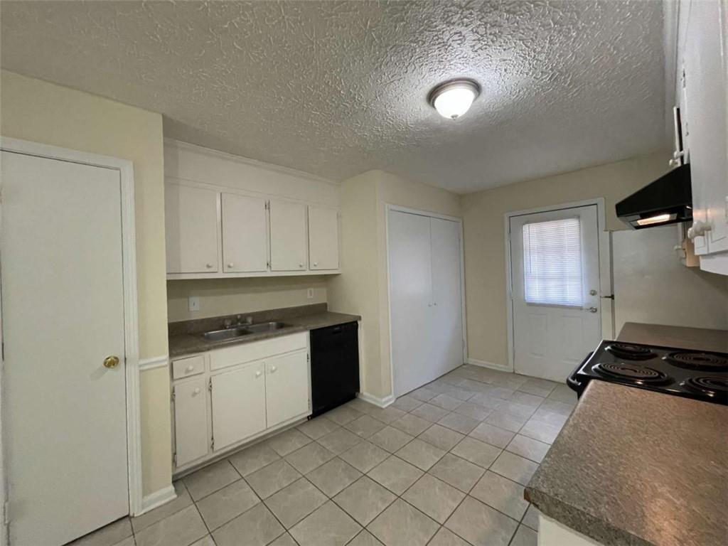 100 Plum Orchard Road, Unit B Covington, GA 30016 - Photo 7 of 15 a kitchen with granite countertop a stove and a sink