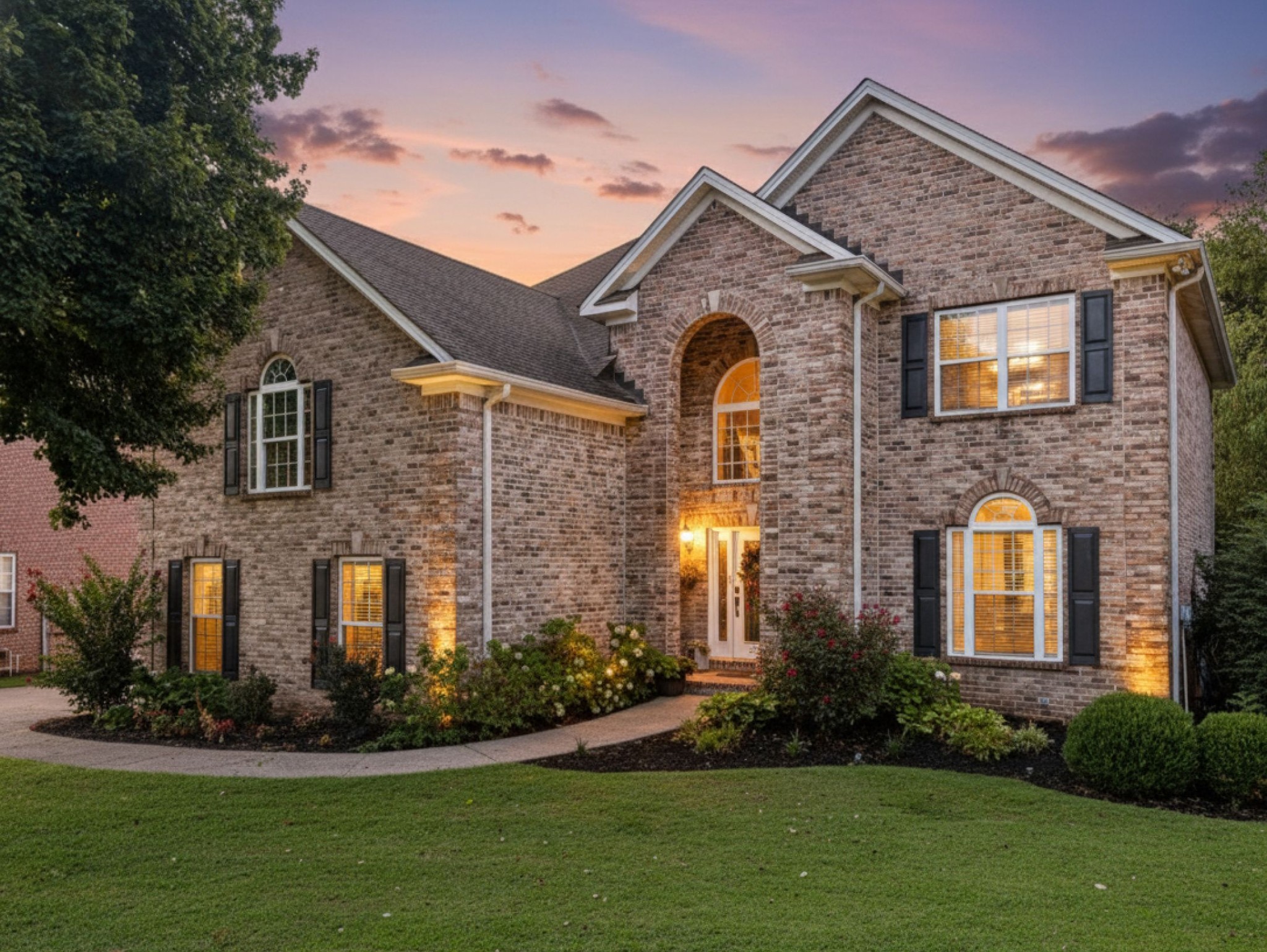 a front view of a house with a yard
