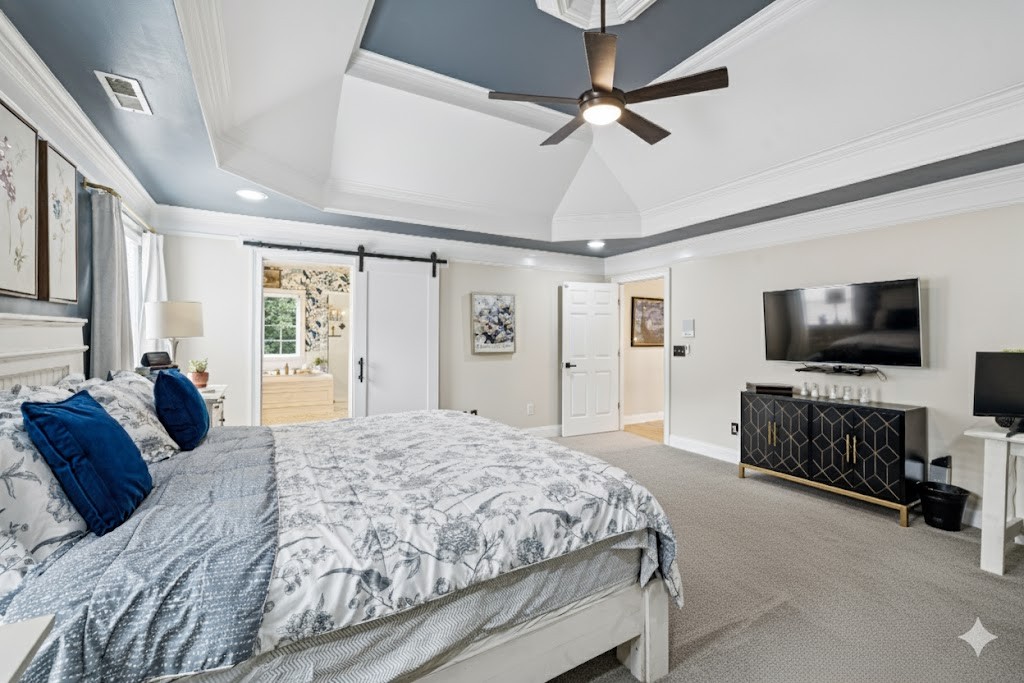 1617 Fair House Road Spring Hill, TN 37174 - Photo 17 of 31 a bedroom with a bed and a flat screen tv