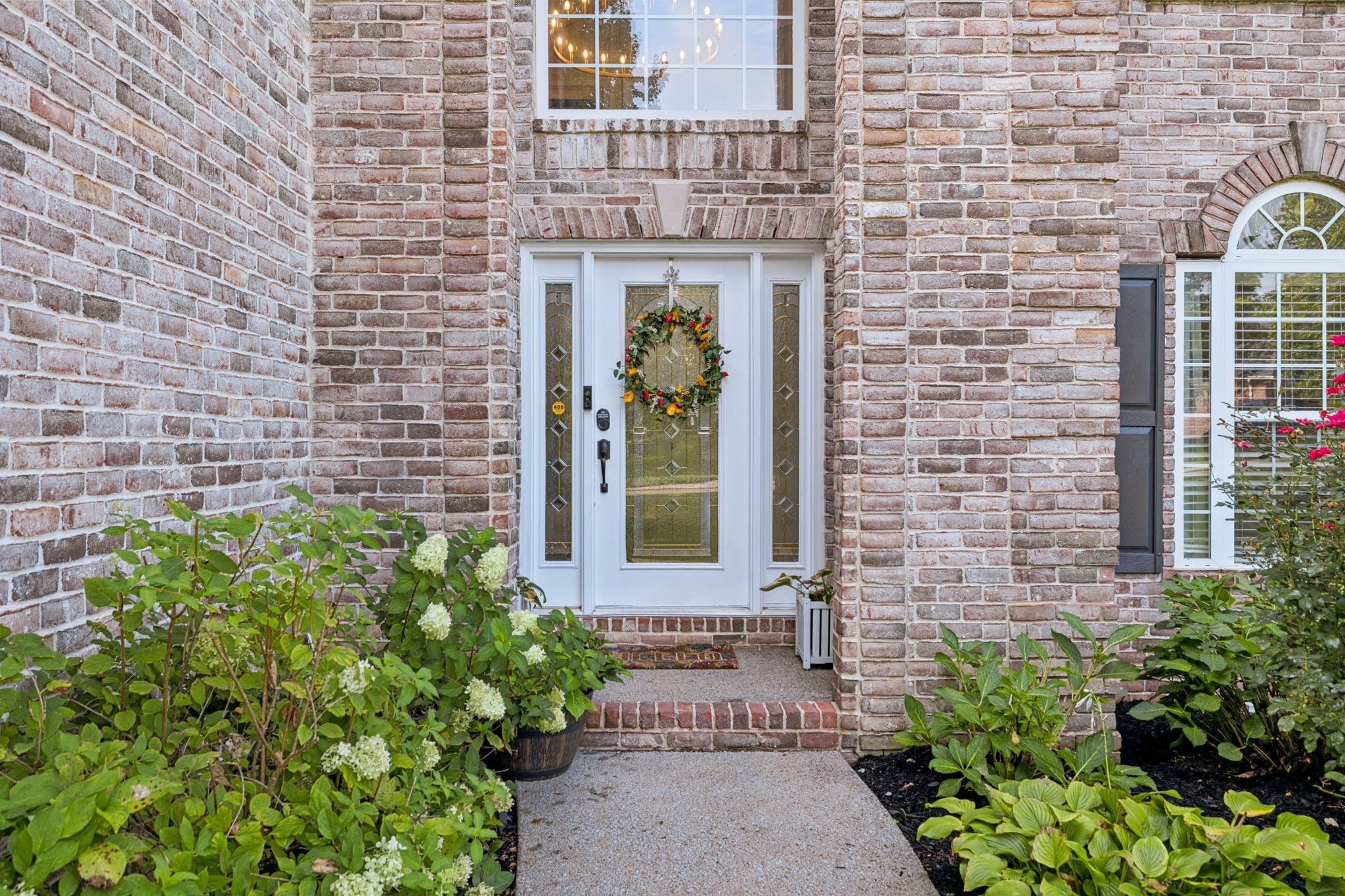 1617 Fair House Road Spring Hill, TN 37174 - Photo 2 of 31 a front view of a brick house with a large windows