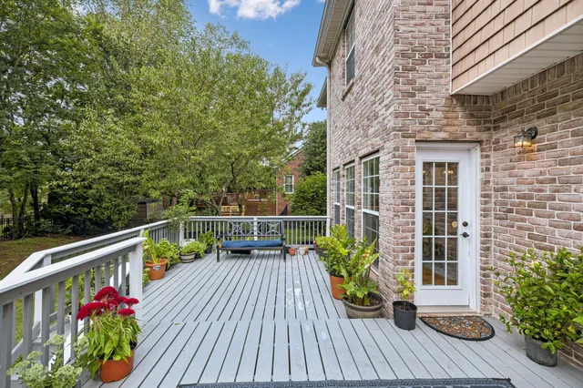 a balcony with wooden floor