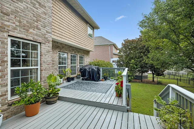a view of a house with backyard sitting area and garden