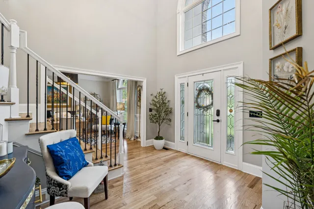 a view of front door and porch with wooden floor
