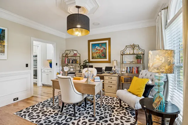 a living room with furniture a rug and a window