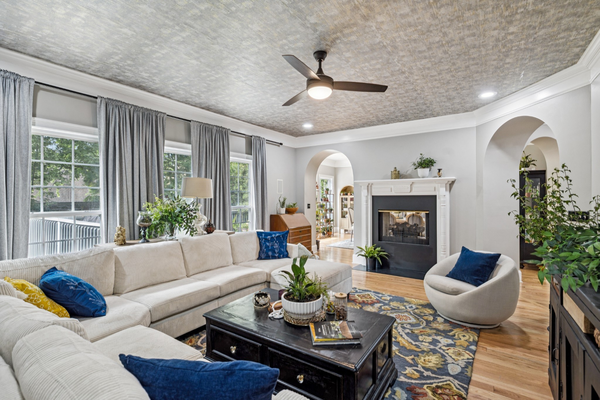 1617 Fair House Road Spring Hill, TN 37174 - Photo 9 of 31 a living room with furniture potted plant and a fireplace