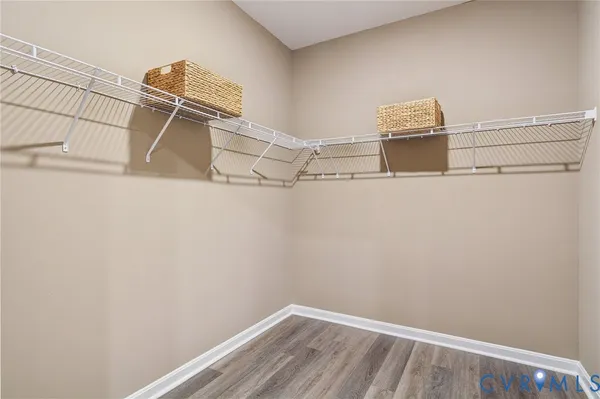 a view of storage and utility room with racks on the wall