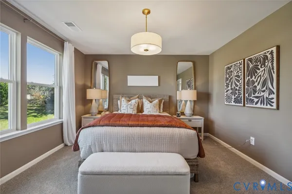 a bed room with a bed and a window