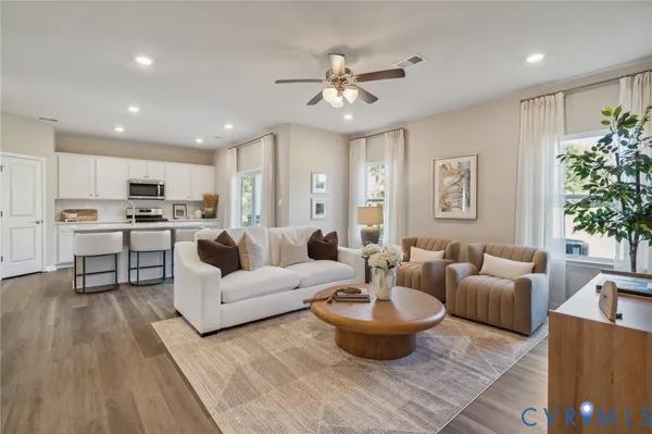 a living room with furniture and a large window
