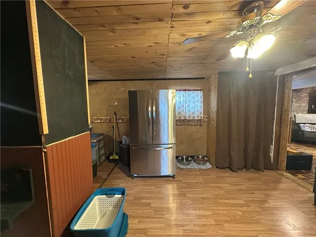 a kitchen with stainless steel appliances granite countertop a stove and a wooden cabinets