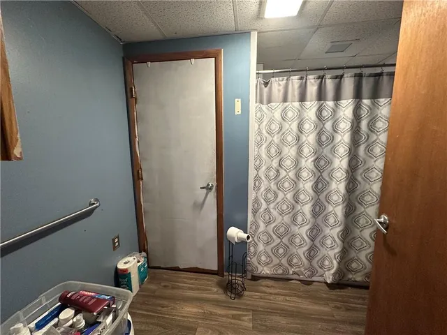 a garage with a couch and a walk in closet