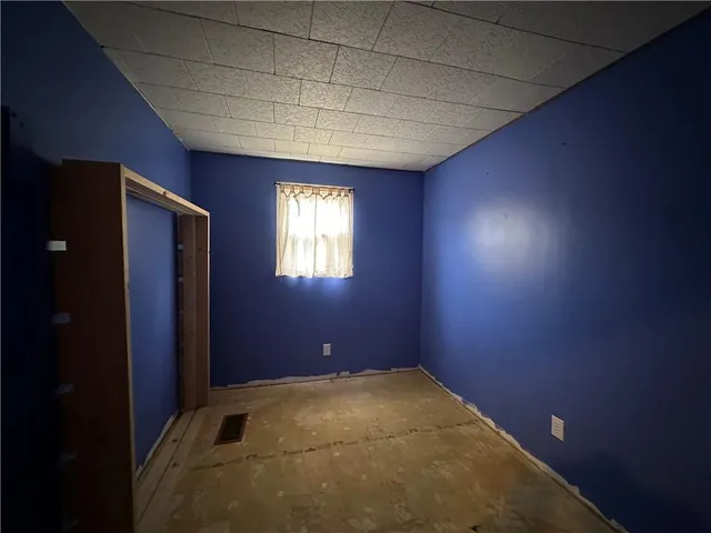 a room with furniture and a flat screen tv