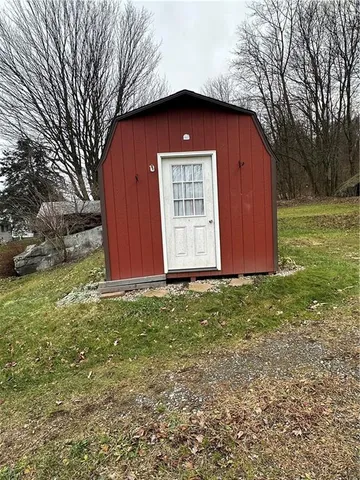 a view of a yard with large trees
