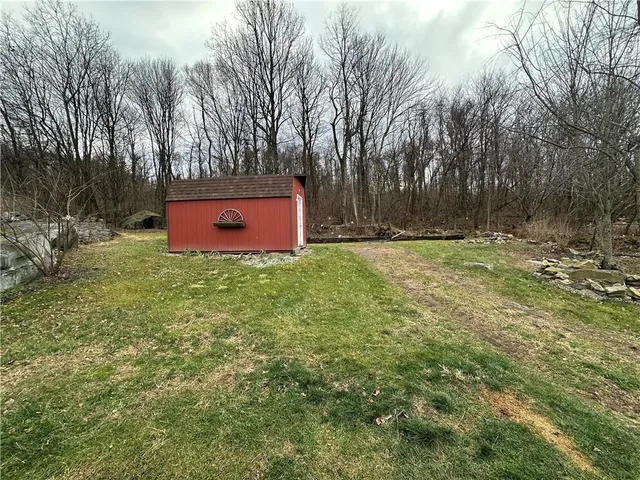 a kitchen with stainless steel appliances granite countertop a stove and a wooden floors