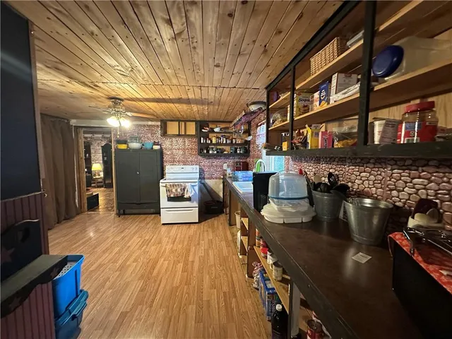 a view of a room with wooden floor and staircase