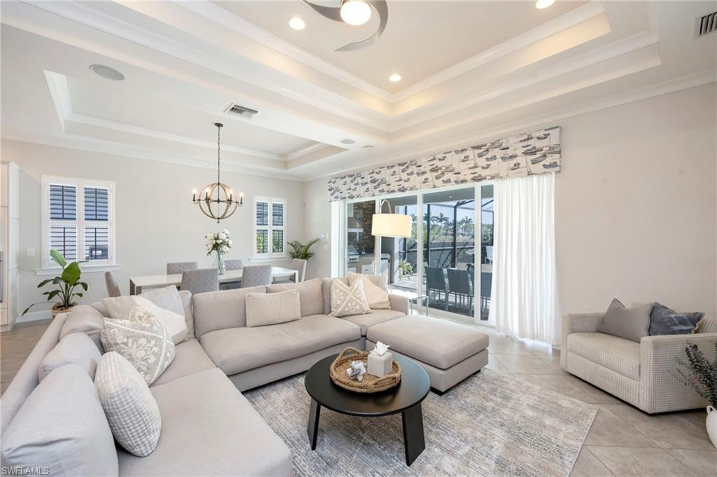 6466 Warwick Avenue Naples, FL 34113 - Photo 6 of 43 a living room with furniture and a large window