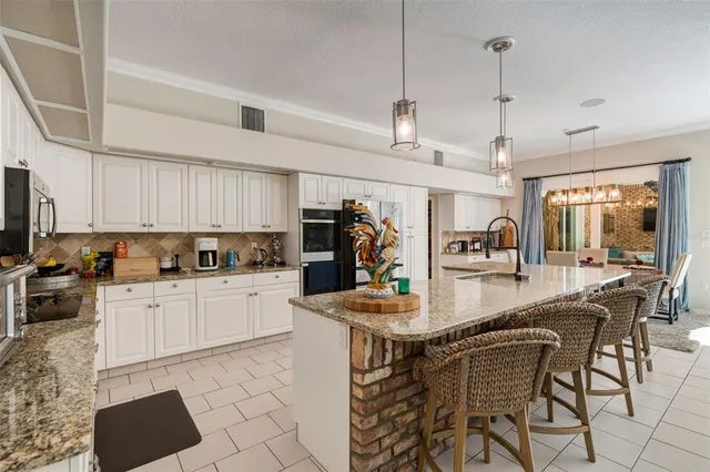 a living room with furniture fireplace and a large window