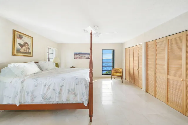 a bathroom with a double vanity sink a mirror and a bathtub