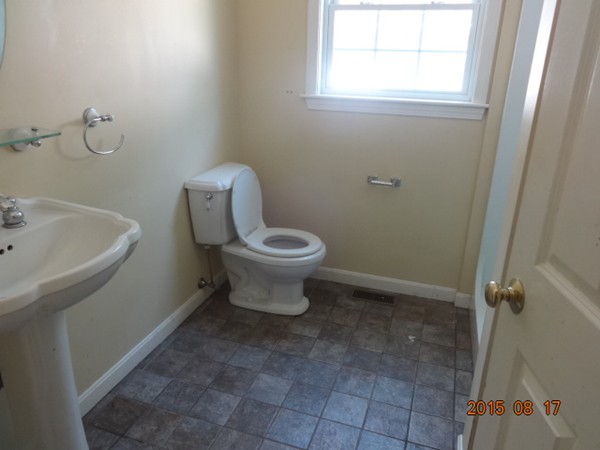 243 Perry Hill Road Acushnet, MA 02743 - Photo 6 of 17 a bathroom with a toilet sink and a mirror