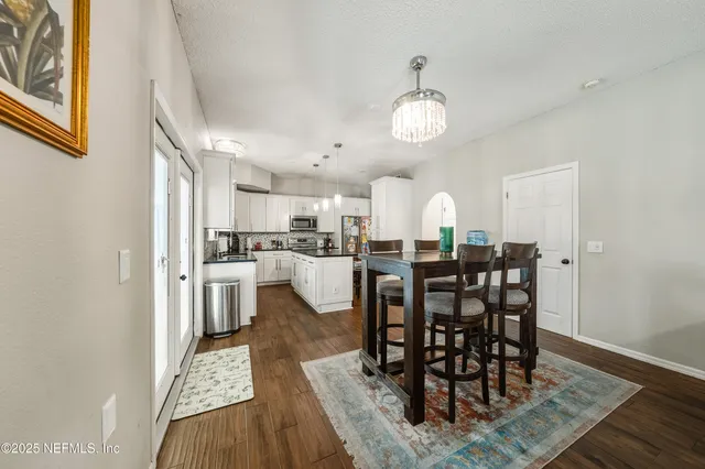a bathroom with a shower and a glass door