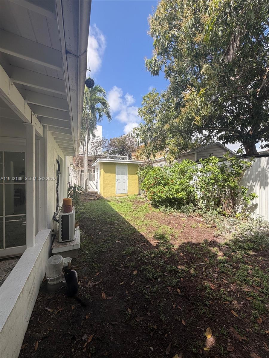 1025 Southwest 12th Street, Unit 2 Miami, FL 33129 - Photo 3 of 13 a front view of a house with a yard