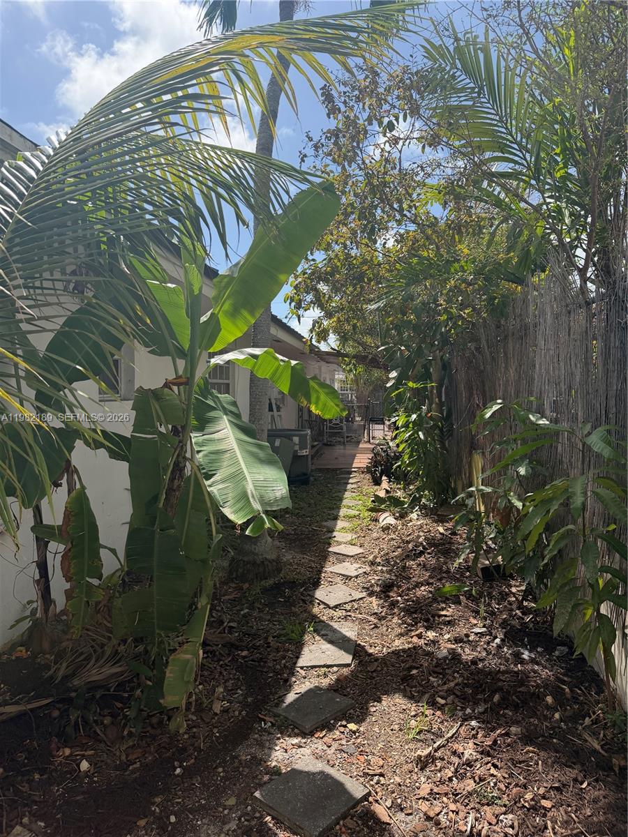 1025 Southwest 12th Street, Unit 2 Miami, FL 33129 - Photo 4 of 13 a view of a pathway of a yard