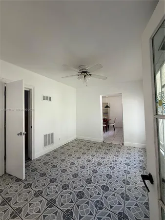 a view of a hallway with a window