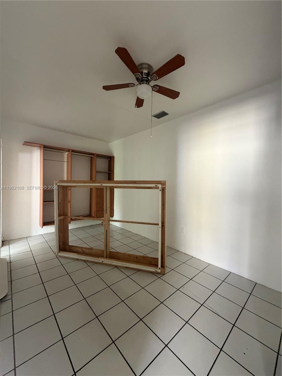 1025 Southwest 12th Street, Unit 2 Miami, FL 33129 - Photo 10 of 13 a empty room with a ceiling fan