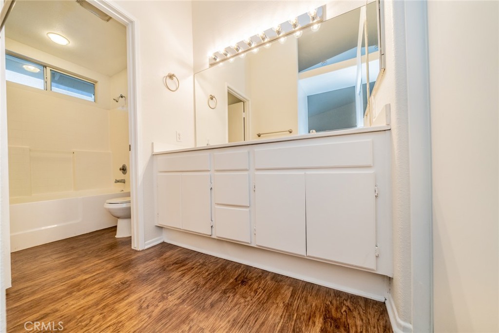 635 Laxford Road San Jacinto, CA 92583 - Photo 13 of 37 a view of a bathroom with a sink and a mirror