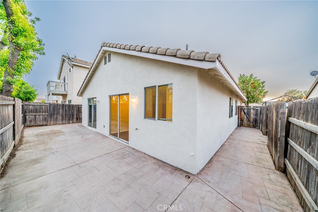 635 Laxford Road San Jacinto, CA 92583 - Photo 29 of 37 a view of backyard with wooden fence and floor