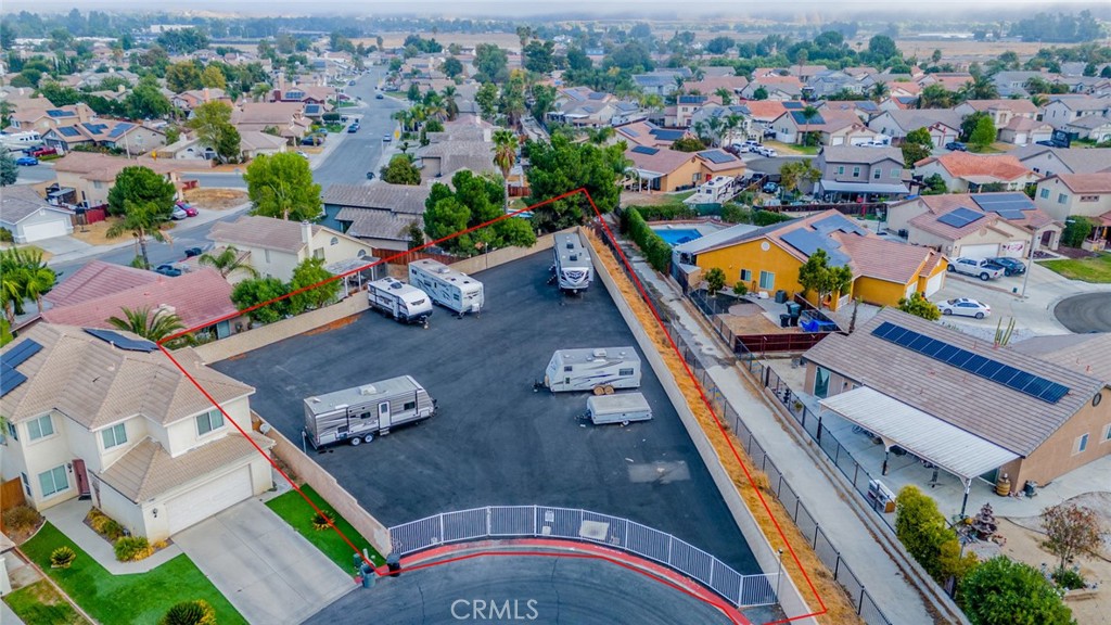 635 Laxford Road San Jacinto, CA 92583 - Photo 36 of 37 an aerial view of a house with a swimming pool yard and mountain view in back