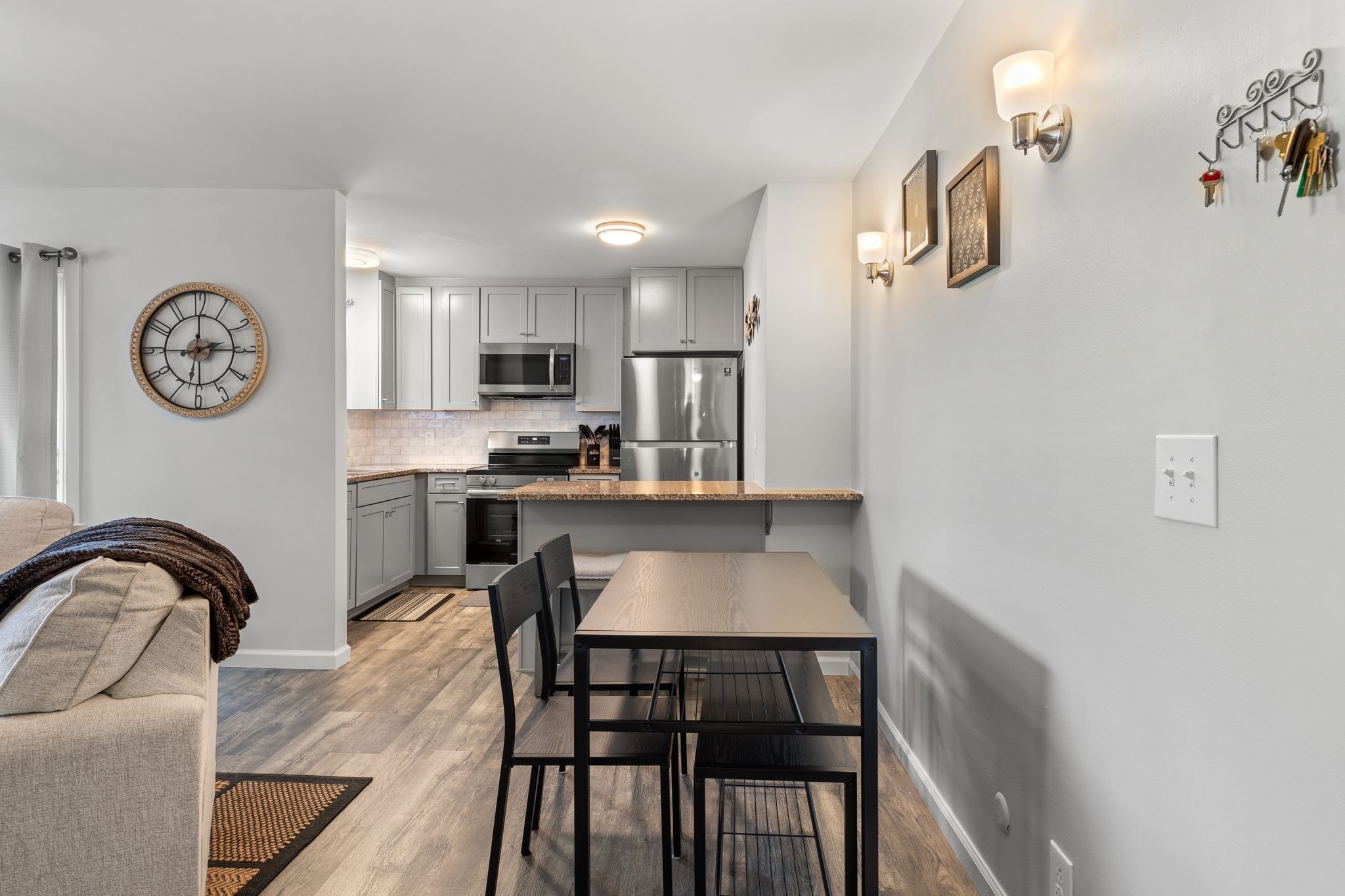 613 Hillsboro Road, Unit A11 Franklin, TN 37064 - Photo 3 of 26 a kitchen with a table chairs a sink and dishwasher