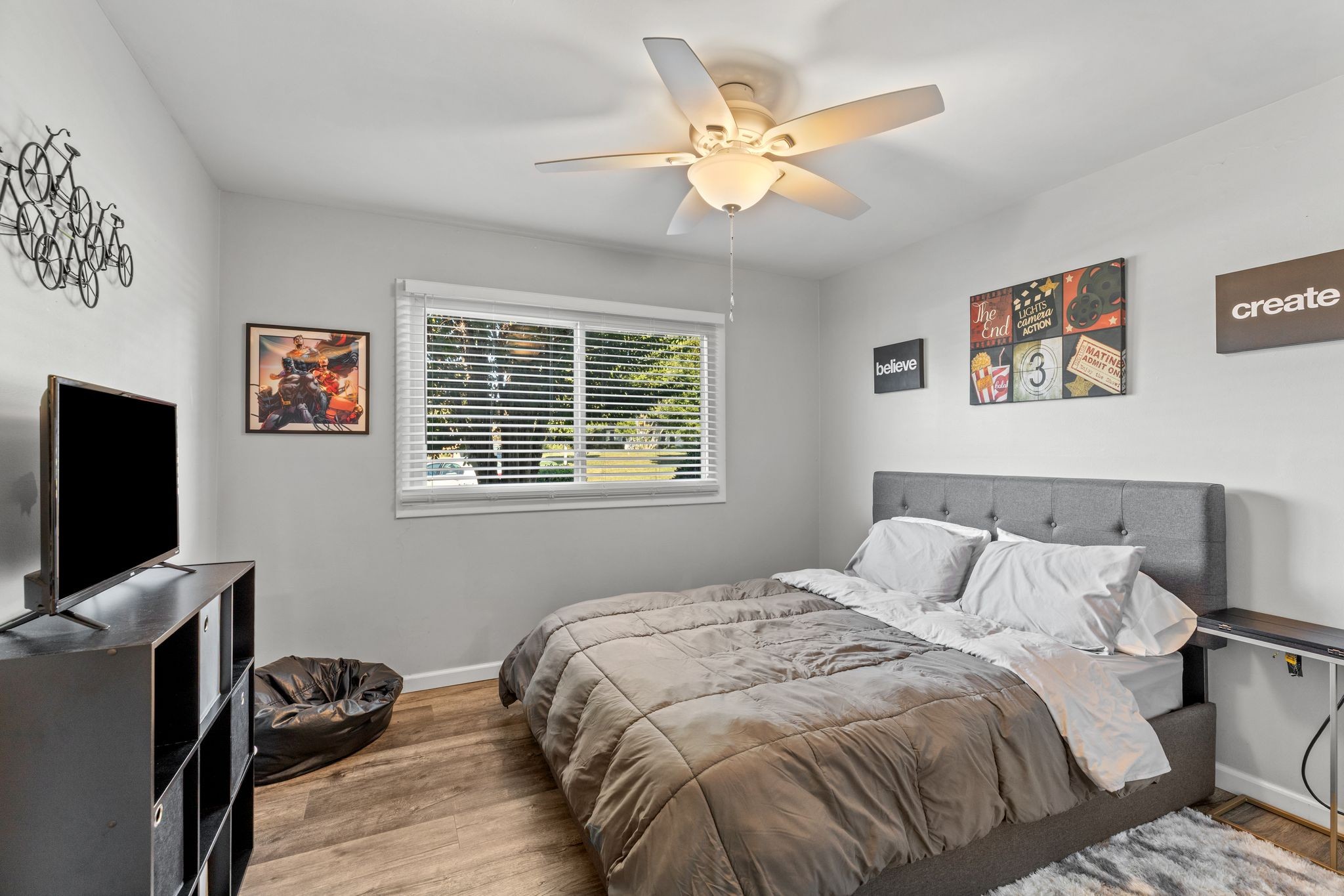 613 Hillsboro Road, Unit A11 Franklin, TN 37064 - Photo 7 of 26 a bedroom with a bed and a flat screen tv