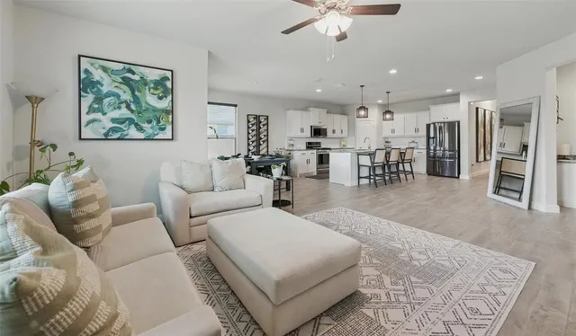 a living room with furniture and a large window