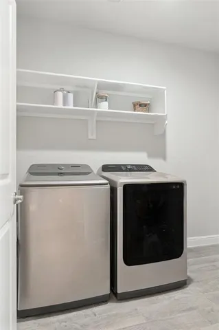 a utility room with washer and dryer