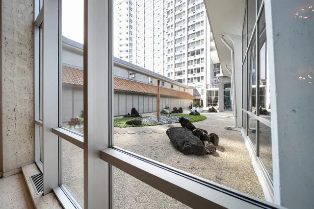 a kitchen with a sink and chandelier