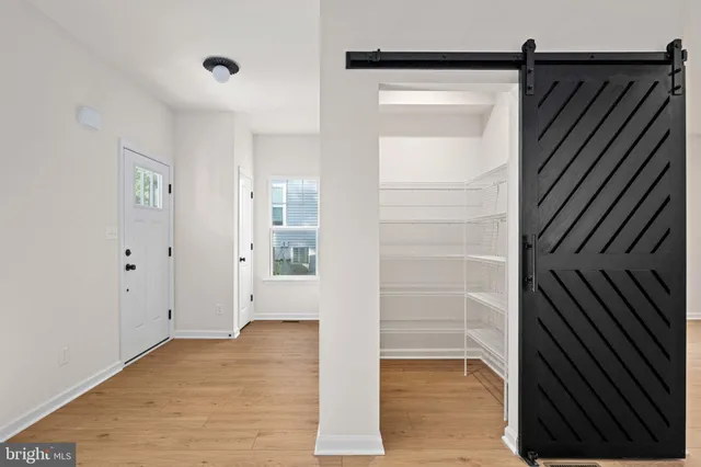 a kitchen with stainless steel appliances a stove sink and microwave