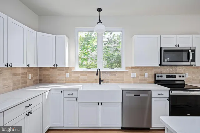 a view of a hallway with wooden shelves