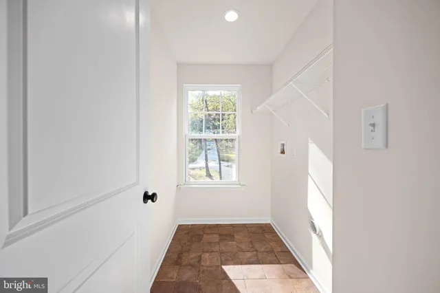 an aerial view of a house with a yard basket ball court and outdoor seating
