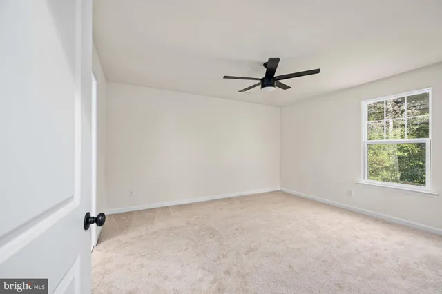 an aerial view of a house with a lake view