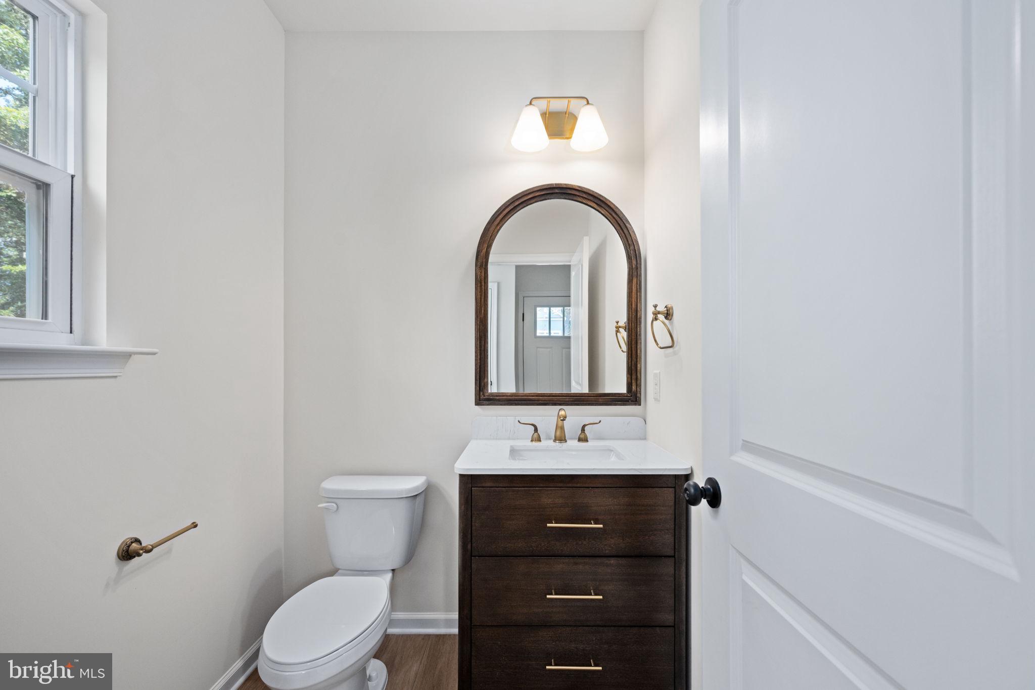 107 Saylers Creek Road Locust Grove, VA 22508 - Photo 5 of 78 a bathroom with a toilet sink and mirror