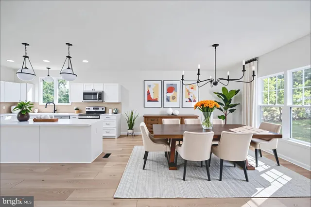 an empty room with wooden floor and outdoor space